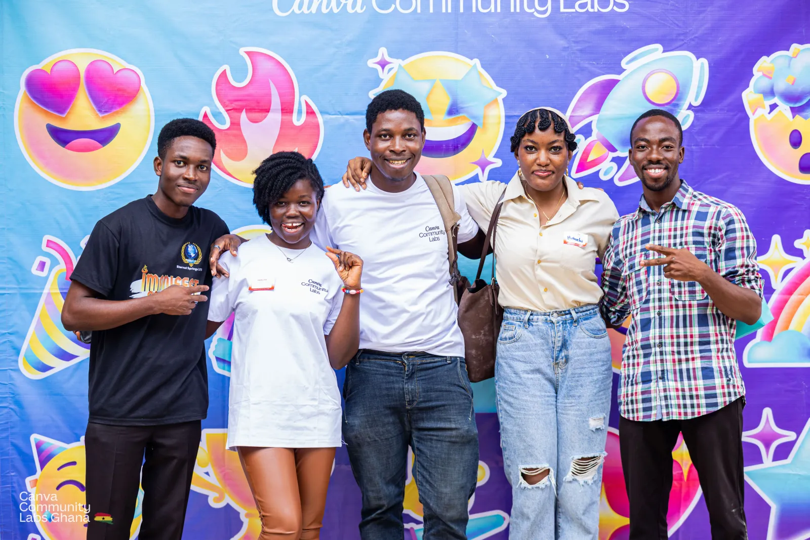 Attendees posing at the Canva Community Labs Ghana photo backdrop
